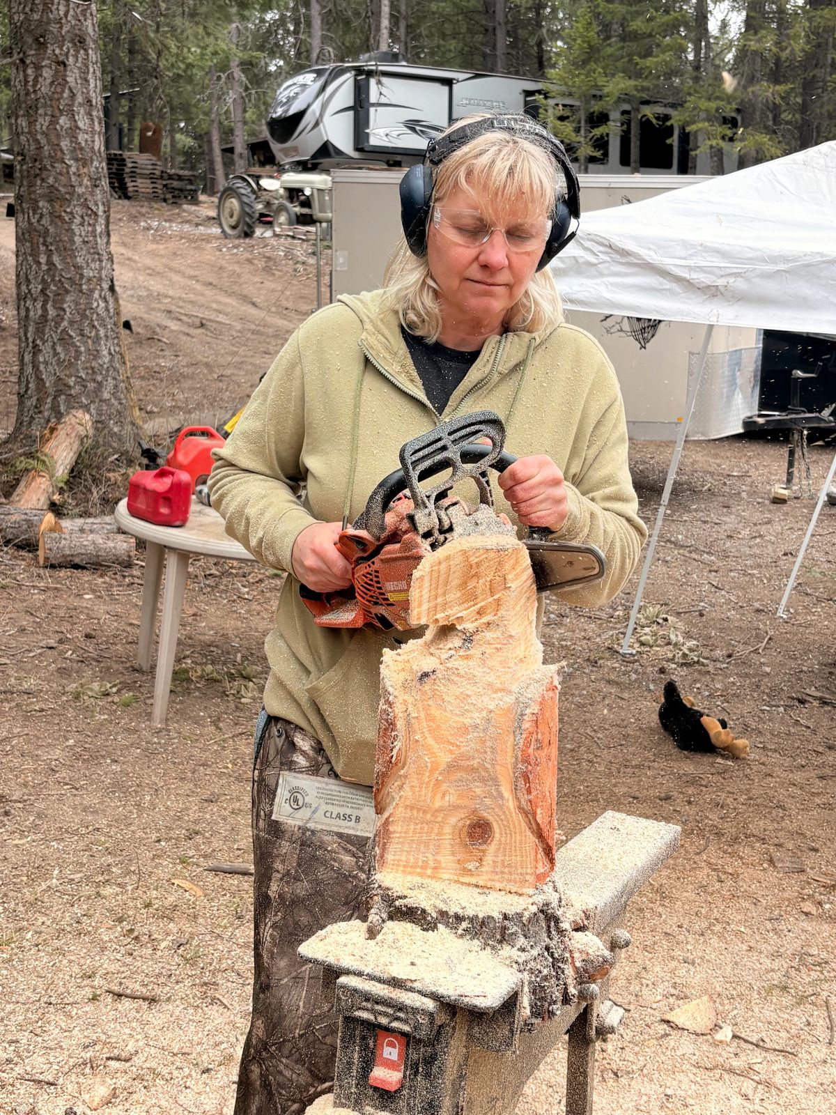 Carving retreat participant working on a wood sculpture